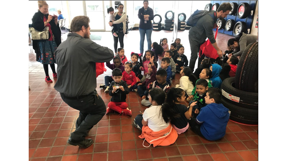 Firestone complete auto care teammates teaching children about tires